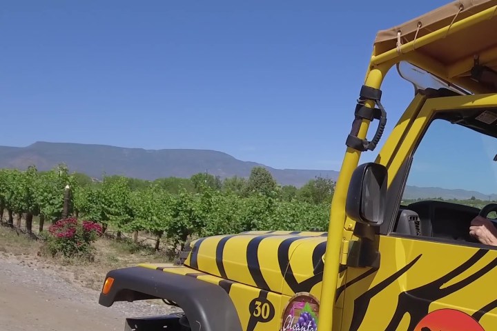 a truck driving down a dirt road